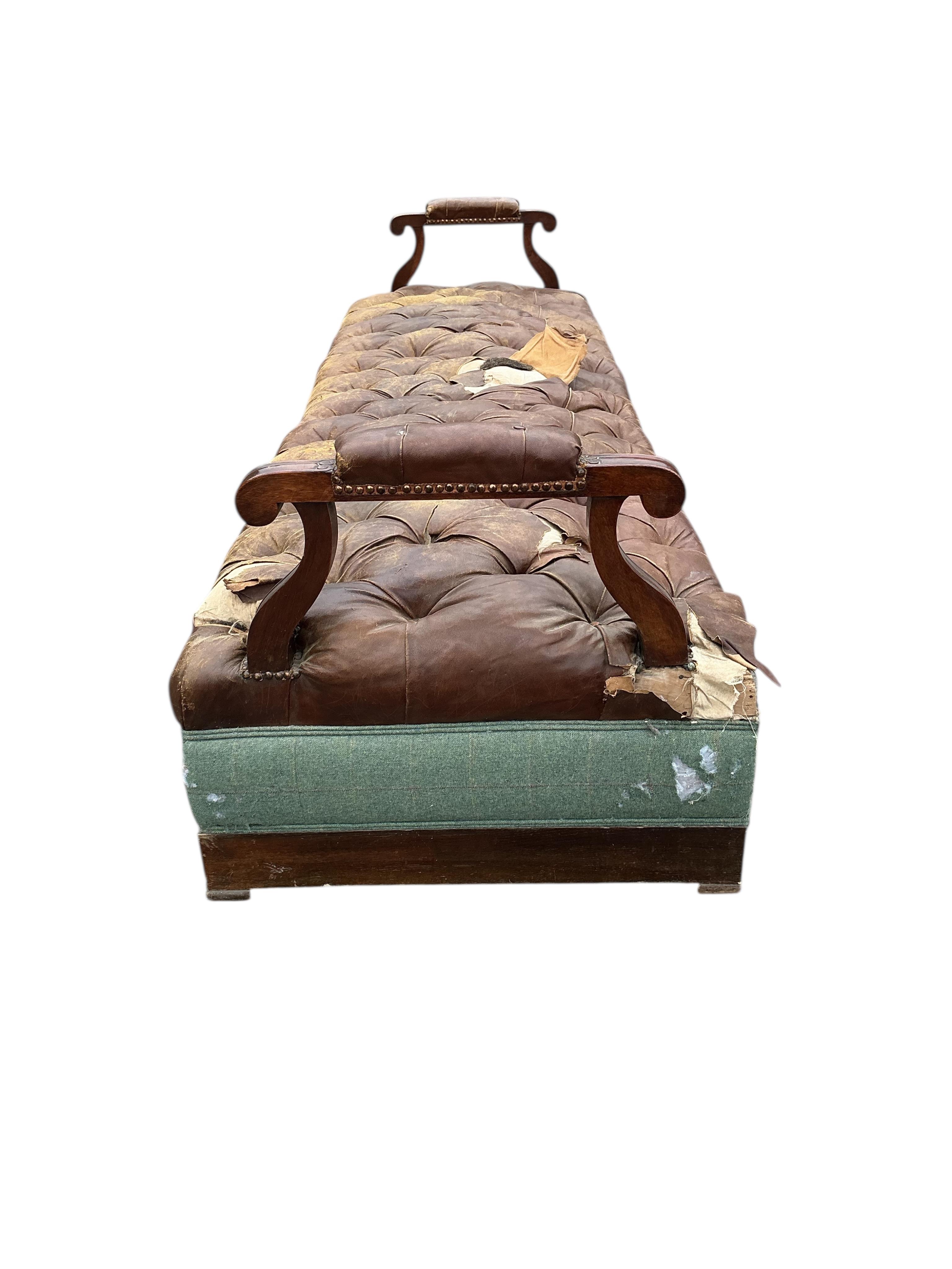 A Victorian oak and buttoned brown leather bench seat, width 266cm, depth 84cm, height 72cm